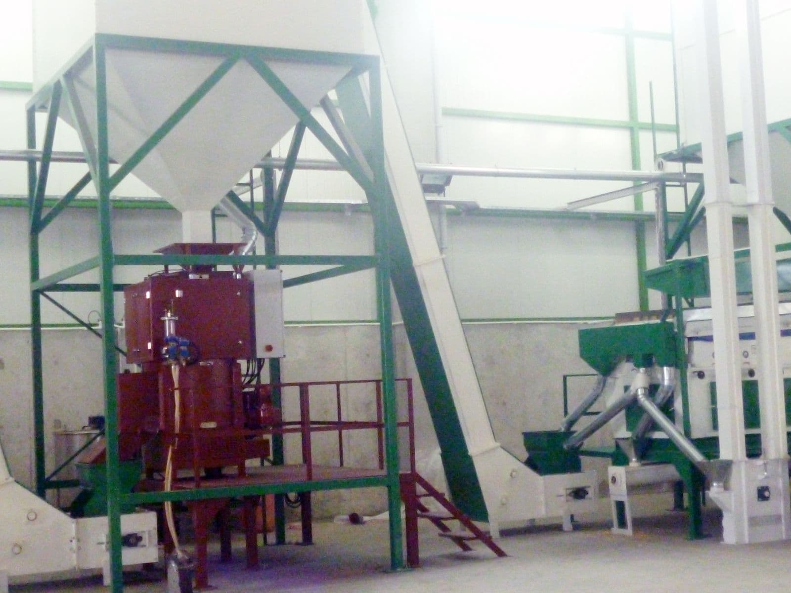 Seed processing line and hoppers